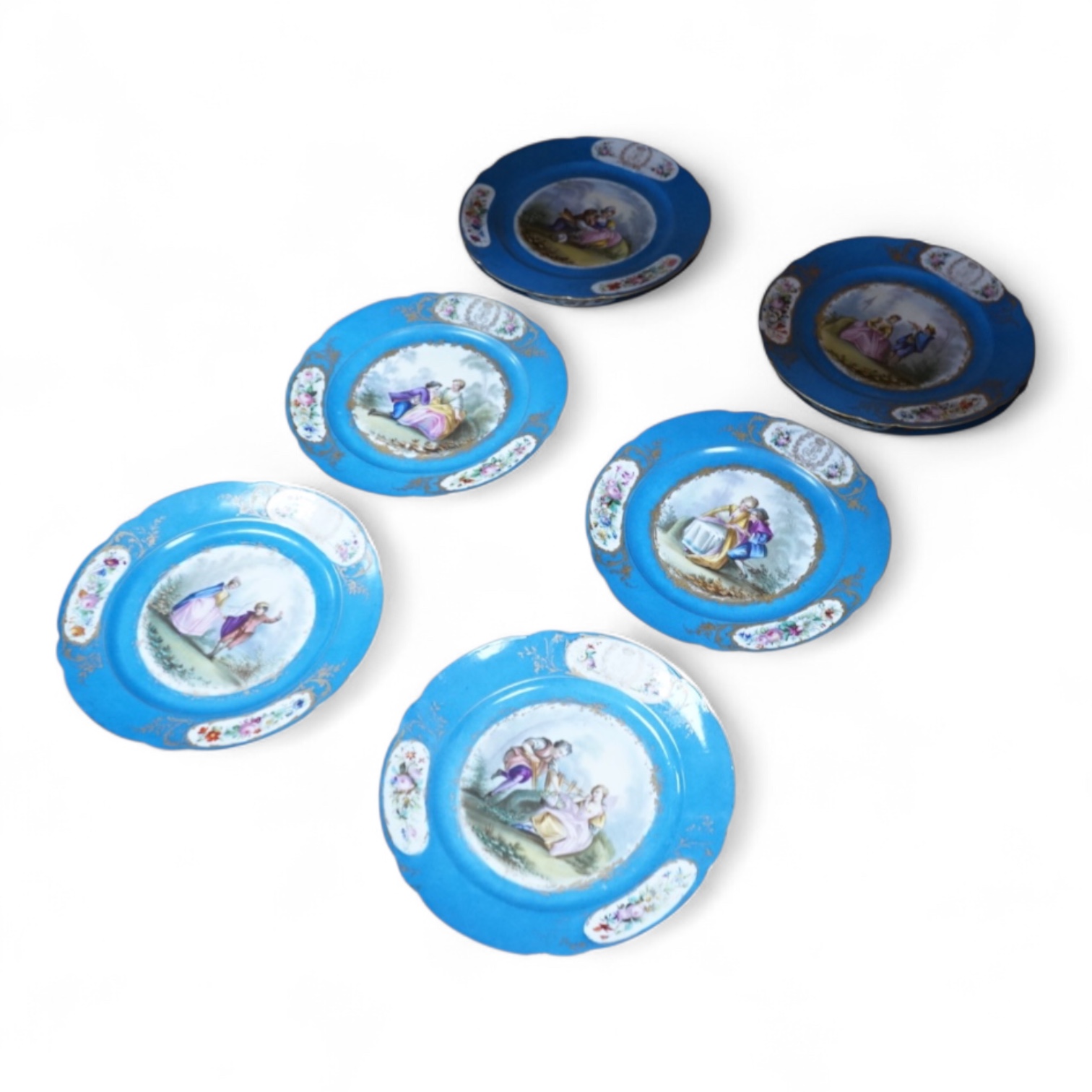 A set of eight 19th century Sevres style bleu celeste ground cabinet plates, each painted with a courting couple, 22cm diameter